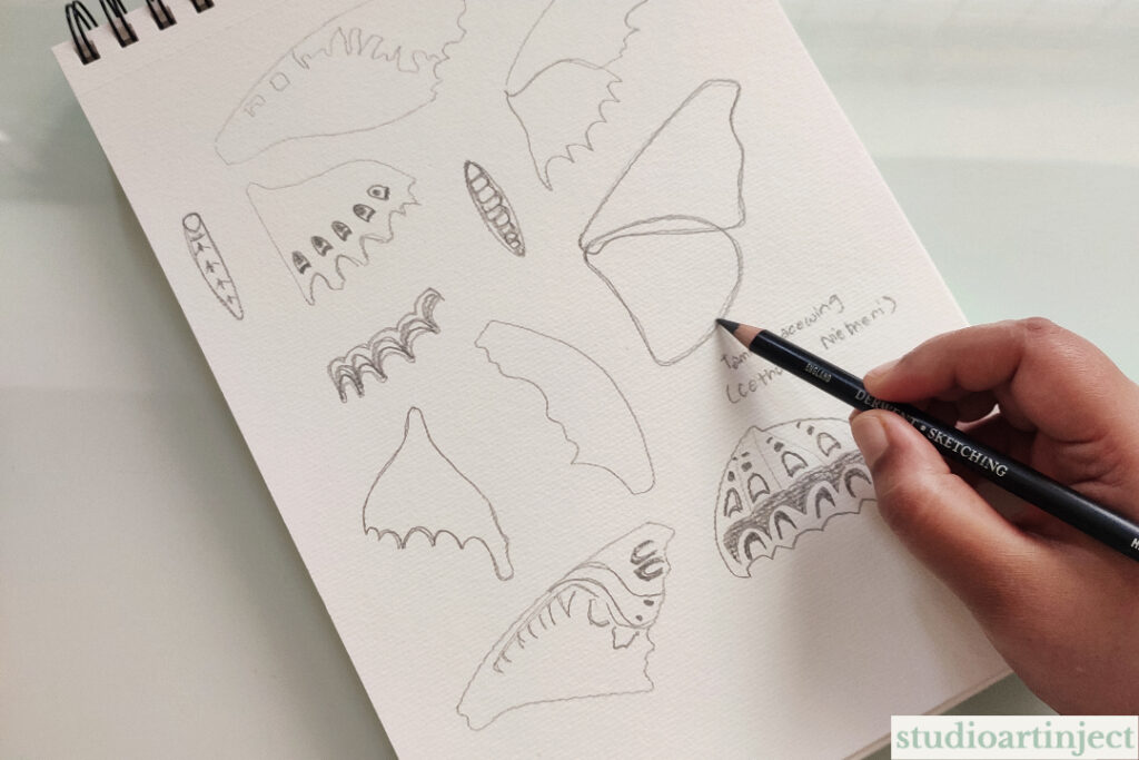 Artist Shimona Ghosh creating the initial sketches for her Butterfly Totems mixed-media painting collection