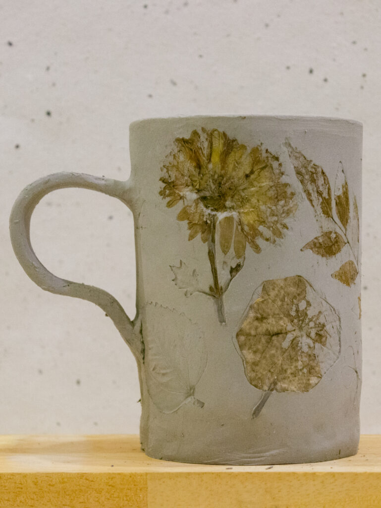 Feb 2025 Delhi In person Pottery Workshop Handmade Floral Clay Cup Ceramic Mug Left Profile